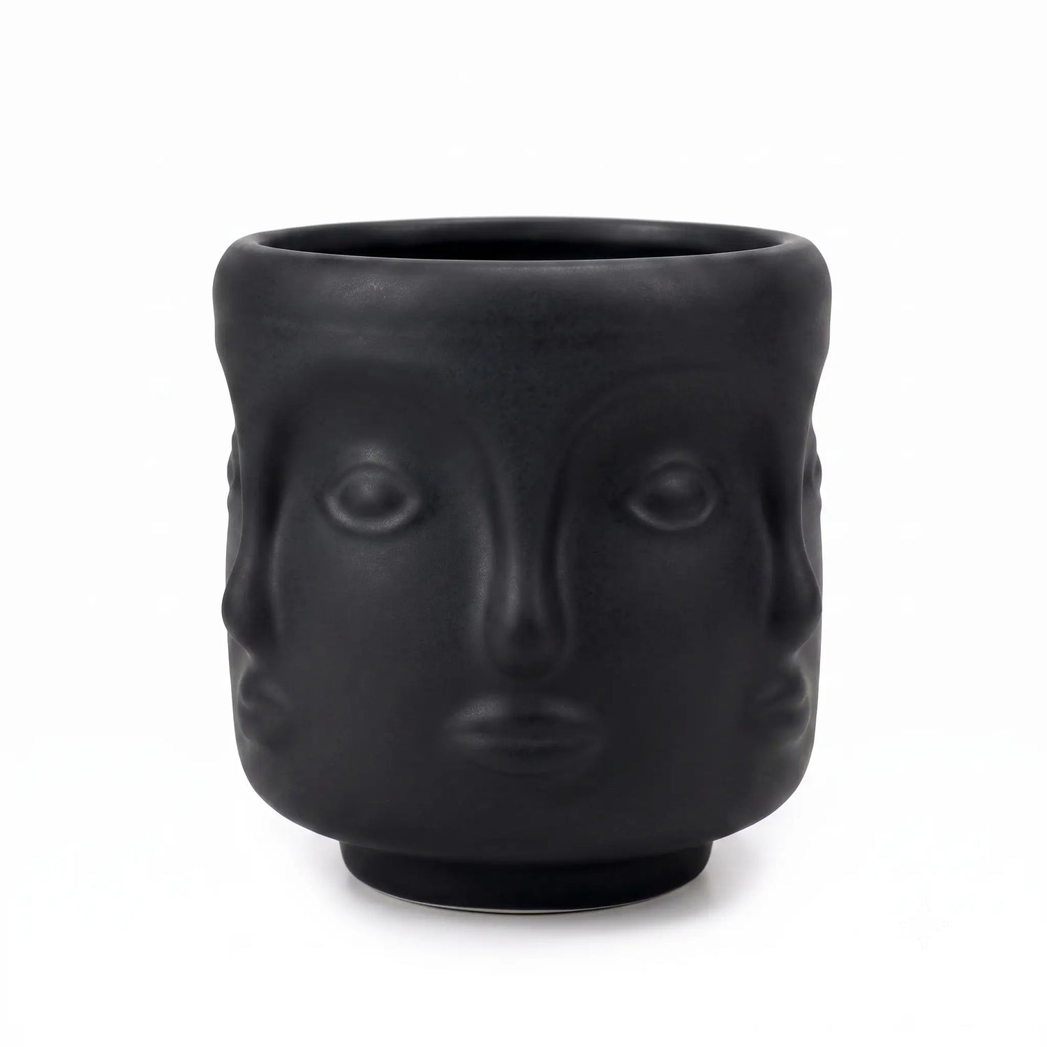 Wholesale matte black 3D sculptural face glass candle vessel 3.5 oz under spotlight