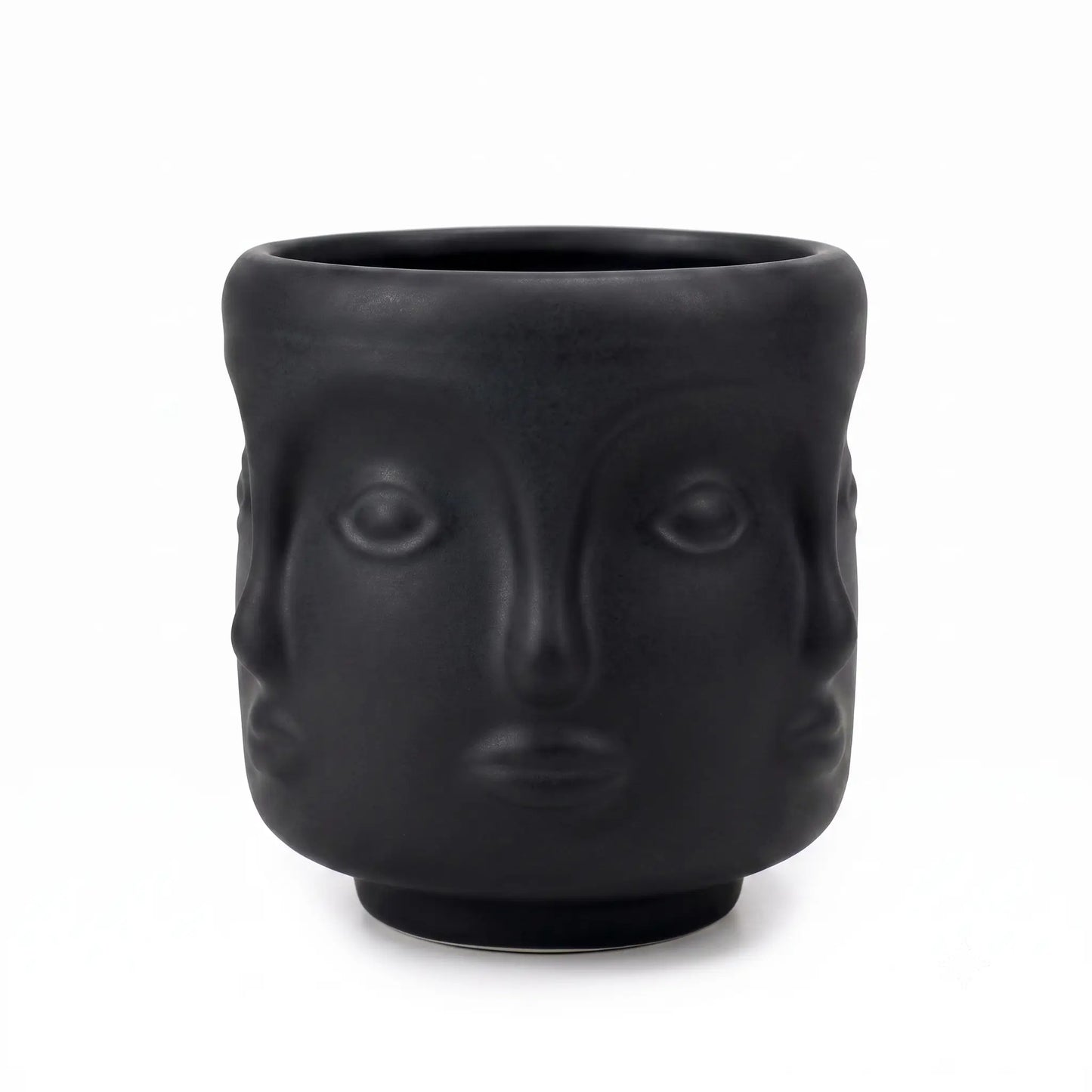 Wholesale matte black 3D sculptural face glass candle vessel 3.5 oz under spotlight