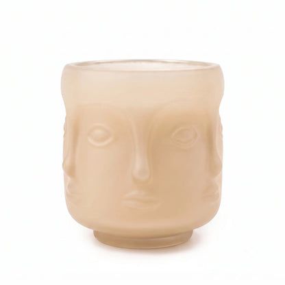 Wholesale oat colored 3D sculptural face glass candle vessel 3.5 oz under spotlight