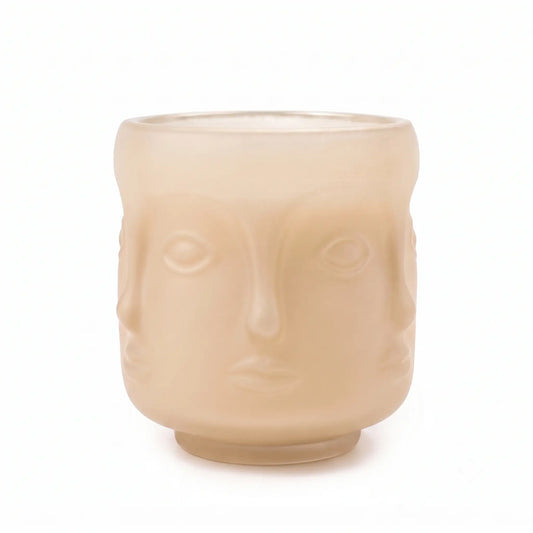 Wholesale oat colored 3D sculptural face glass candle vessel 3.5 oz under spotlight