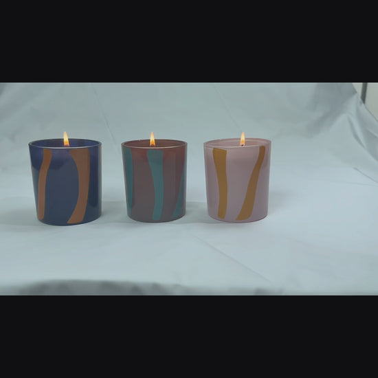 Hand holding the Nordic Stripe pure glass candle vessel. Showcasing the 3.5mm heavy-wall thickness and architectural Cut-Out texture that perfectly hides wax wet spots for premium candle makers.