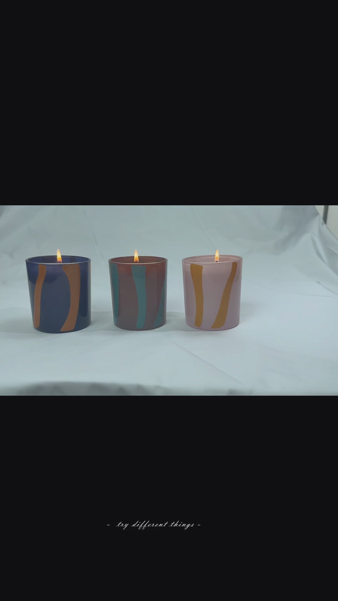 Hand holding the Nordic Stripe pure glass candle vessel. Showcasing the 3.5mm heavy-wall thickness and architectural Cut-Out texture that perfectly hides wax wet spots for premium candle makers.