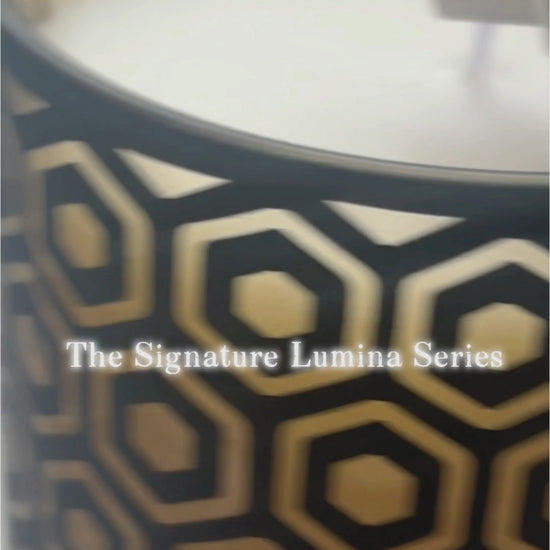 Signature Lumina diamond cut-out architectural glass candle vessel burn test, showcasing geometric light projection, heavy-wall durability, and perfect soy wax adhesion for wholesale candle makers.