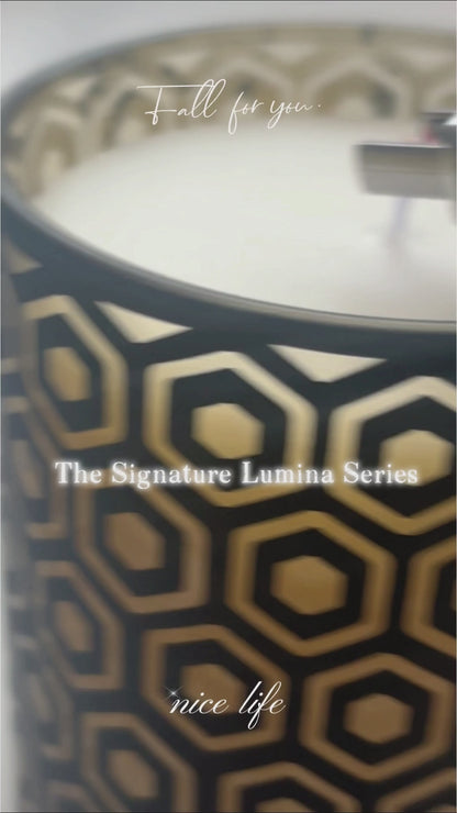 Signature Lumina diamond cut-out architectural glass candle vessel burn test, showcasing geometric light projection, heavy-wall durability, and perfect soy wax adhesion for wholesale candle makers.