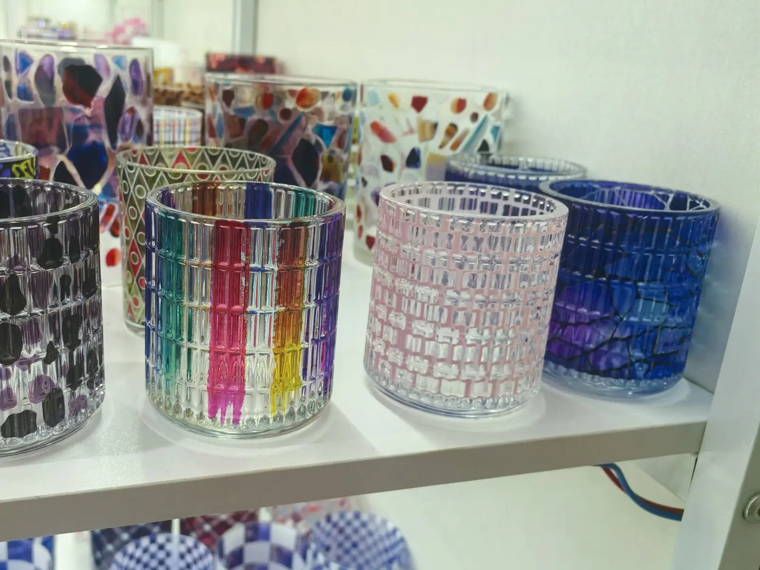 Decorative glass candle vessels in the Verse & Vessel showroom