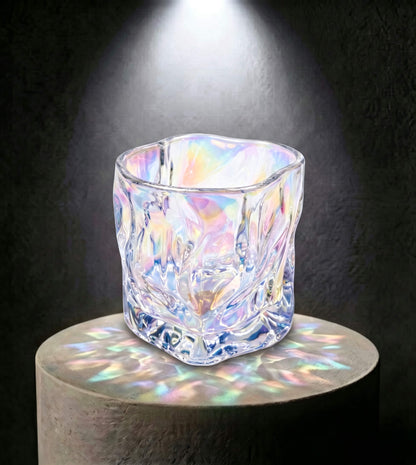 Wholesale iridescent prism artisan glass candle vessel 6.5 oz casting rainbow light reflections under spotlight