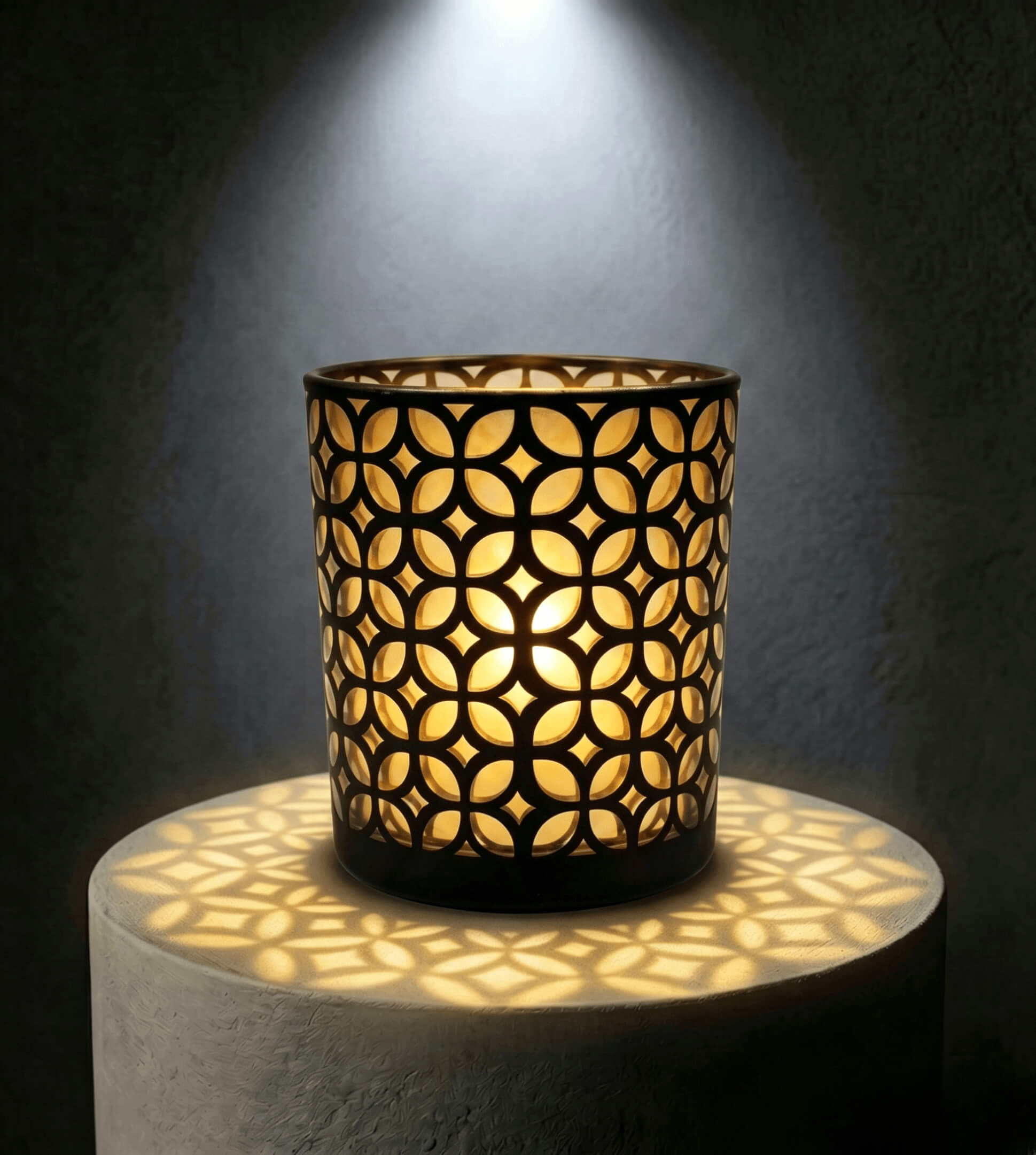 Wholesale matte black and gold interwoven cut out candle vessel 8 oz casting fluid geometric light shadows under spotlight