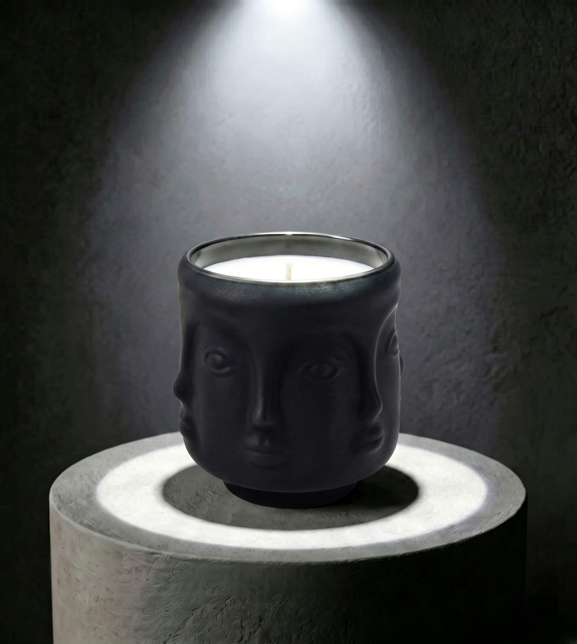 Wholesale matte black 3D sculptural face glass candle vessel 3.5 oz under spotlight