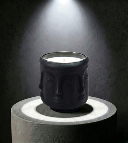Wholesale matte black 3D sculptural face glass candle vessel 3.5 oz under spotlight