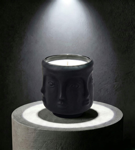 Wholesale matte black 3D sculptural face glass candle vessel 3.5 oz under spotlight