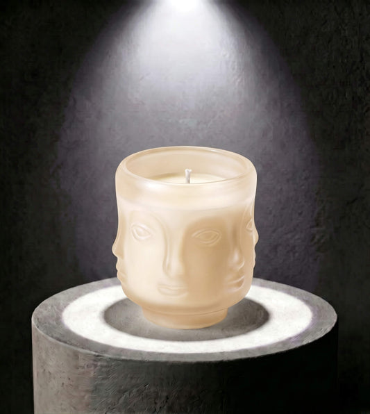 Wholesale oat colored 3D sculptural face glass candle vessel 3.5 oz under spotlight